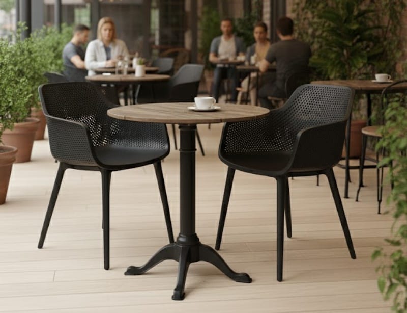 Black plastic dining chairs with a table